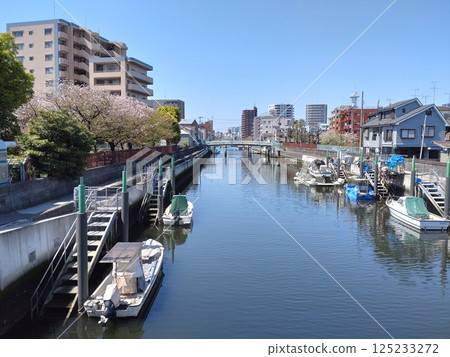 A dock on the river in the town 125233272