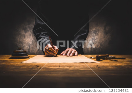 Elegant Sketch of a Person Drawing on Kraft Paper in Artistic Setting with Tools Elegant Sketch of a Person Drawing on Kraft Paper in Artistic Setting with Tools 125234481