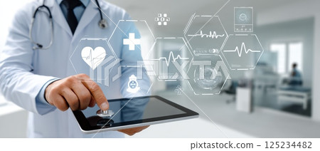 Doctor using tablet to analyze holographic health data in modern medical environment 125234482