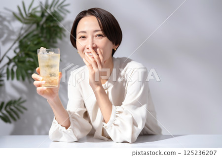 Woman drinking highball 125236207