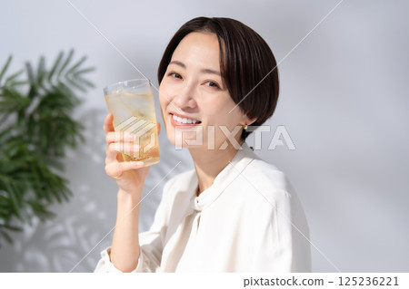 Woman drinking highball 125236221