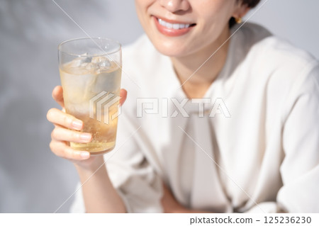 Woman drinking highball 125236230