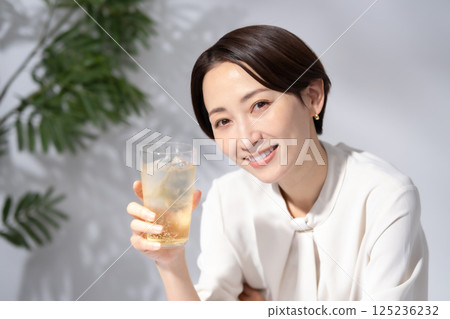 Woman drinking highball 125236232