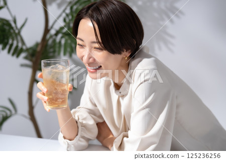 Woman drinking highball 125236256