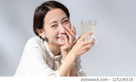 Woman drinking highball 125236318
