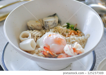 rice with soft boiled egg and seafood, seafood and rice 125237389