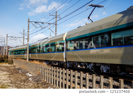 Tobu Express Liberty running on the Nikko Line on a clear winter day Tobu Express Liberty running on the Nikko Line on a clear winter day 125237408