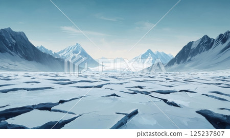 A desolate, icy landscape with mountains in the background 125237807