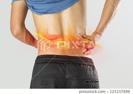 Man experiences shingles rash along waistline. 125237899