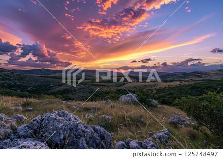 Vibrant Sunset Over Mountainous Landscape 125238497