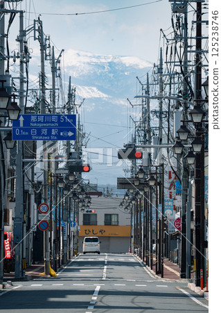 A shopping street bathed in the morning sunlight and snow-covered mountains A shopping street bathed in the morning sunlight and snow-covered mountains 125238746