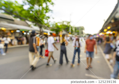 Bangkok, Thailand - Jun 4, 2022 : Crowd of tourist shopping in Chatuchak or Jatujak weekend market in Bangkok, Thailand. This place is a famous and popular travel destination among tourist. 125239136