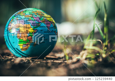 Small globe showing Africa and the Middle East on natural ground Small globe showing Africa and the Middle East on natural ground 125239440