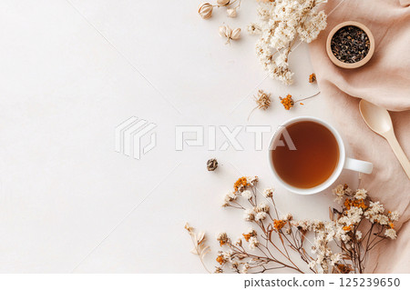Minimalist setup with organic herbal tea, dried flowers and natural elements for a calm lifestyle 125239650