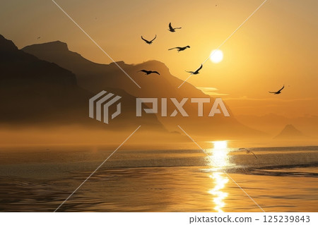 The birds are scattered throughout the sky, with some flying closer to the water The birds are scattered throughout the sky, with some flying closer to the water 125239843