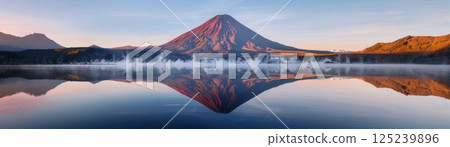 Mountain Reflections on Tranquil Lake at Sunrise 125239896