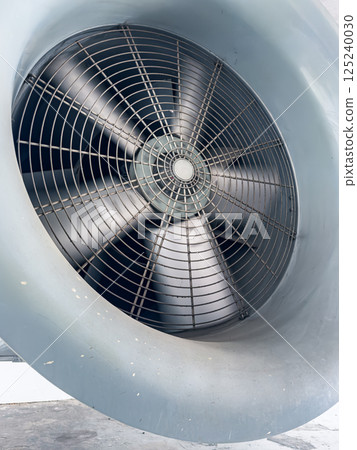 Large industrial fan in a factory setting 125240030