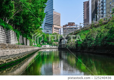 View from the Kanda River Cruise: Tokyo buildings and embankments, Sotobori-bune (Outer Moat Boat Transport), Marunouchi Line Hijiribashi Bridge, etc. View from the Kanda River Cruise: Tokyo buildings and embankments, Sotobori-bune (Outer Moat Boat Transport), Marunouchi Line Hijiribashi Bridge, etc. 125240436