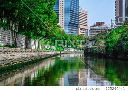 View from the Kanda River Cruise: Tokyo buildings and embankments, Sotobori-bune (Outer Moat Boat Transport), Marunouchi Line Hijiribashi Bridge, etc. View from the Kanda River Cruise: Tokyo buildings and embankments, Sotobori-bune (Outer Moat Boat Transport), Marunouchi Line Hijiribashi Bridge, etc. 125240441