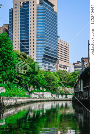 View from the Kanda River Cruise: Tokyo buildings and embankments, Sotobori-bune (Outer Moat Boat Transport), Marunouchi Line Hijiribashi Bridge, etc. View from the Kanda River Cruise: Tokyo buildings and embankments, Sotobori-bune (Outer Moat Boat Transport), Marunouchi Line Hijiribashi Bridge, etc. 125240444