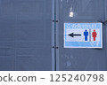 A sign indicating where the toilets are 125240798