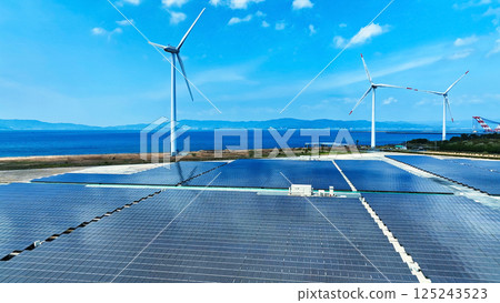 Aerial view of a hybrid wind and solar power plant Aerial view of a hybrid wind and solar power plant 125243523