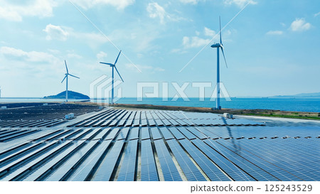 Aerial view of a hybrid wind and solar power plant Aerial view of a hybrid wind and solar power plant 125243529