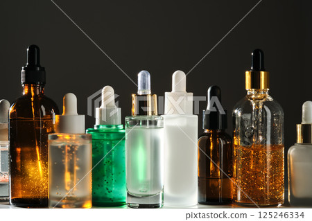 Lots of different face serums in the sun. 125246334