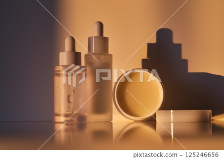 Cosmetic products for skin care in the rays of the setting sun. 125246656