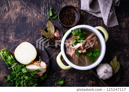 Boiled bone broth or bouillon with meat Boiled bone broth or bouillon with meat 125247117