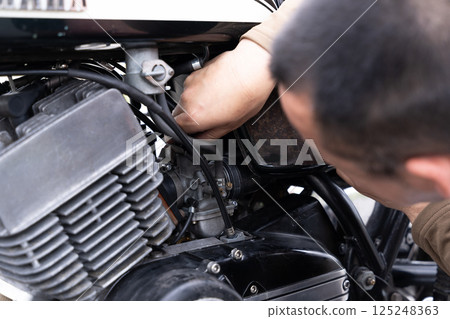 Motorcycle, vintage car, maintenance 125248363