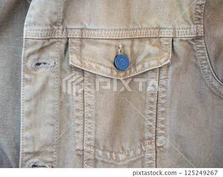 Close-up of a denim fabric pocket and button. High quality photo Close-up of a denim fabric pocket and button. High quality photo 125249267