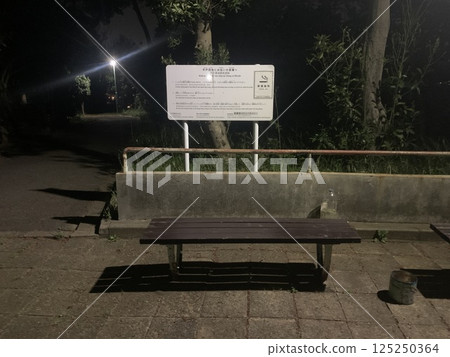 Park bench at night 125250364