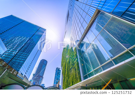 Tokyo cityscape in Japan: Summer-like heat...View of Shibuya Scramble Square and Shibuya Stream reflected in the window glass Tokyo cityscape in Japan: Summer-like heat...View of Shibuya Scramble Square and Shibuya Stream reflected in the window glass 125251732