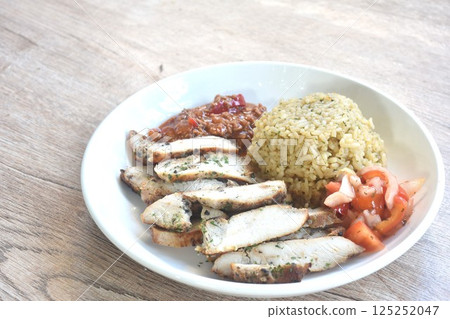 grilled slice chicken black pepper steak dressing tomato sauce with fried rice on plate  125252047