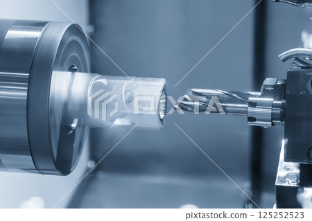 The multi tasking CNC lathe machine Swiss type hole cutting process the metal tube parts in the light blue scene. 125252523