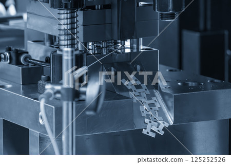 The electrical terminal parts production by progressive die in the light blue scene. The electrical terminal parts production by progressive die in the light blue scene. 125252526