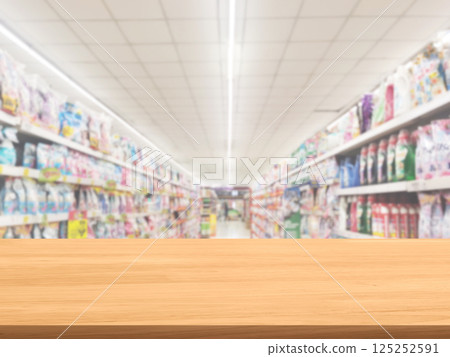 Empty wooden table, blurred shelf background. Empty wooden table, blurred shelf background. 125252591