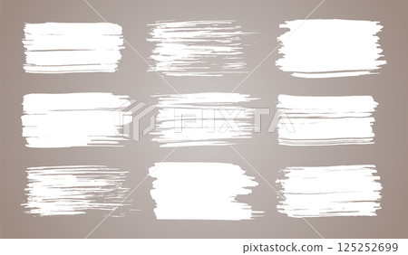 Vector paint brush set. White ink grunge brush strokes. Grunge design elements. Painted ink stripes. Creative isolated spots. Ink smudge, abstract shape stains and smear set 125252699