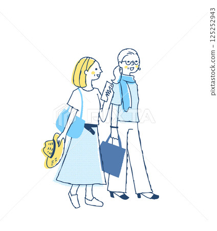Two middle-aged/senior women walking together with smiles 125252943