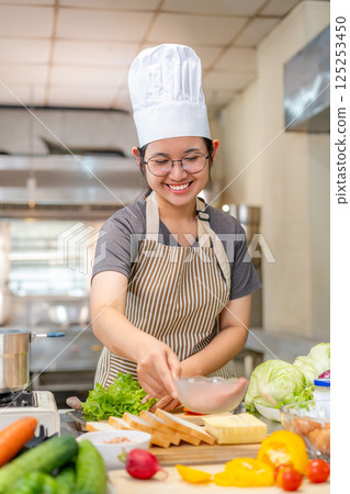 Chef preparing food ingredients  in Professional Kitchen 125253450