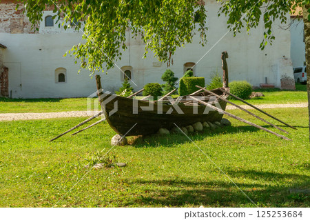 Old Wooden Boat with Oars on Grass, Kirillo-Belozersky Monastery, Russia 125253684