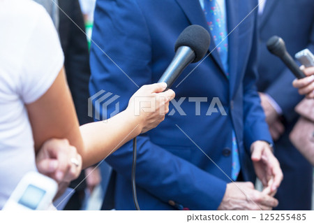 Reporters making media interview with businessman or politician 125255485