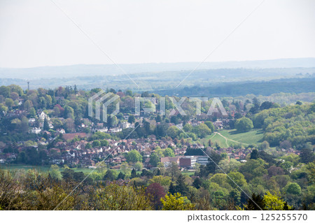 A view of the suburban London cityscape from the top of a hill under blue skies and clouds at Denbies Hillside 125255570