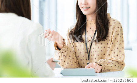 Two women/businesswomen having a meeting Two women/businesswomen having a meeting 125255605