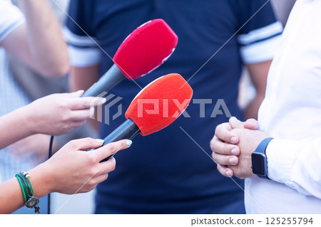 Reporters making press or media interview Reporters making press or media interview 125255794