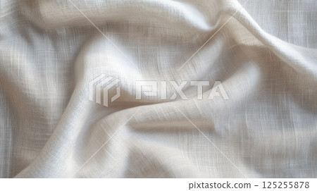 Soft white fabric with vertical folds and gentle shadows, high-resolution textile background for minimal product display and modern studio design 125255878