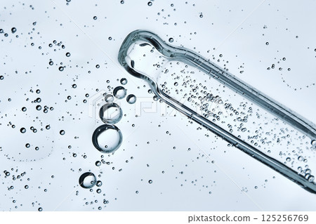 The texture of a serum or cosmetic gel with a pipette. Angle from below. 125256769