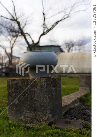 The cast-iron pot stands on a concrete foundation. Soviet cast iron pot 125257061
