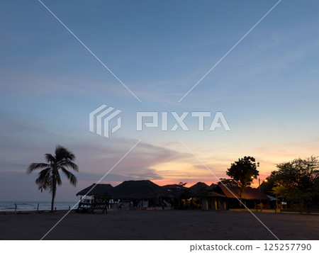 Paradise beach at sunset time Paradise beach at sunset time 125257790